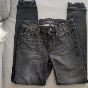 WHBM Classic rise lace-hem Skinny ankle jeans.